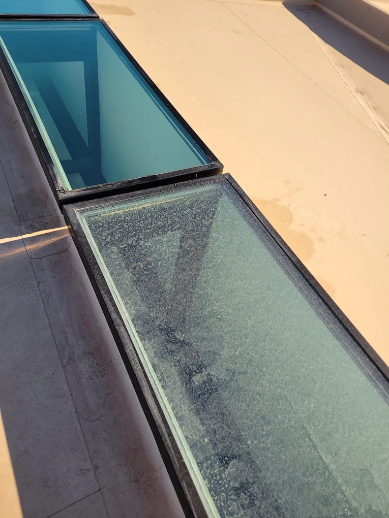 Skylight panel with hard water spots removed